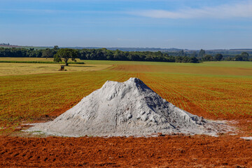 Limestone heap in the plantation area on countryside of Brazil