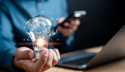 Businessman holding light bulb with innovation, motivation business target planning development...