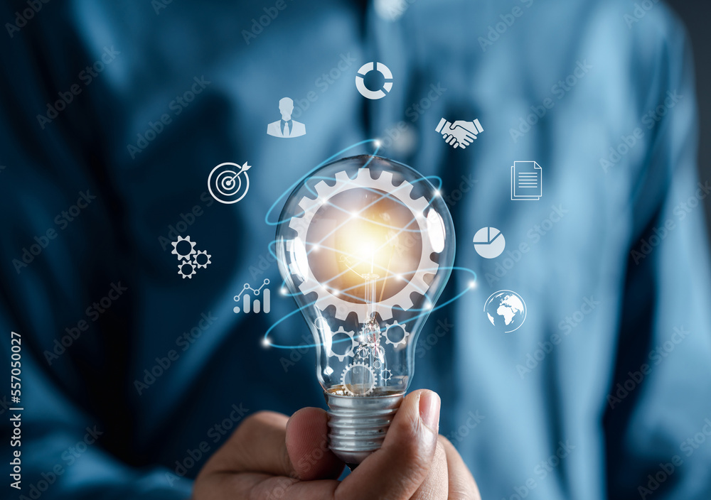 Aufkleber Man hand holding lightbulb with learning educate which for mind, creative, idea, innovation, motivation planning development leadership and customer target group concept...