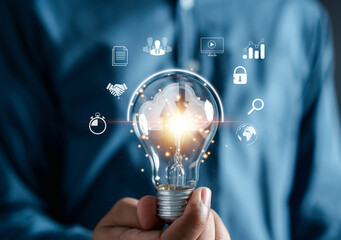 Businessman holding Light bulb global internet connection. planning development leadership and customer target with Business technology and digital marketing, Financial and banking, Digital link tech.
