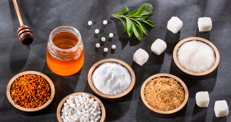 Sugar, stevia leaves, pollen and honey - Variety of natural sweeteners.