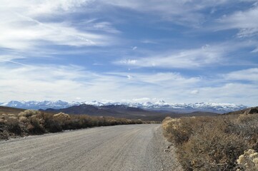 Fototapeta na wymiar country road with mountain view