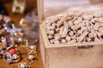 ewellery removed from a jewellery box and replaced by wood pellets, to emphasize the 300% increase in price from 2021-2022 