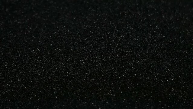Flashing silver and dark grey glitter time lapse background/ graphic resource.