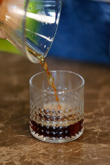 Putting the filter coffee brewed in v60 into the glass