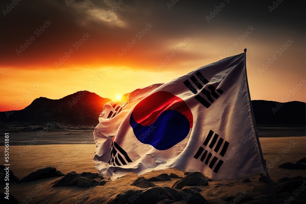 Poster a flag on a beach with a sunset in the background and mountains in the distance with a sky filled wi