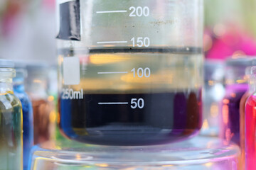A black insoluble substance of copper sulfide settled at the bottom of a beaker.