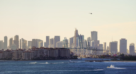 Naklejka premium Beautiful aerial panoramic view of the city of Miami, its buildings, marina, yachts and luxurious suburbs houses