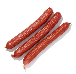 Small smoked sausages on a white isolated background, top view