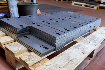 The finished sheet product on a pallet after cutting on a laser cutting machine. Modern cutting of metal with a laser machine.