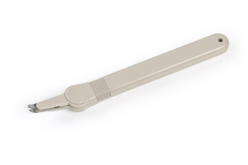 Pen type staple remover on a white background