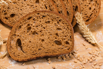 Slices of dark rye and wheat brown bread close-up