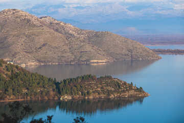 Obraz premium Aerial view of Skadar Lake National park panoramic landscape, Montenegro, Skadarsko jezero, also called Shkodra or Scutari, with mountains in a sunny day