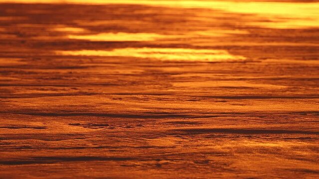 sunset winter on a frozen river in slow motion