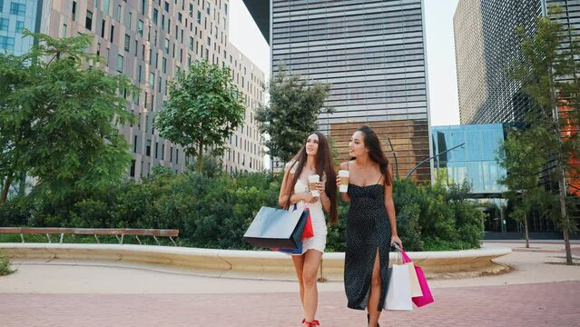 Multiracial women strolling in downtown after shopping