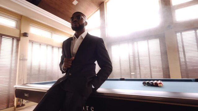 Low Angle Shot Of Man Posing On The Pool Table