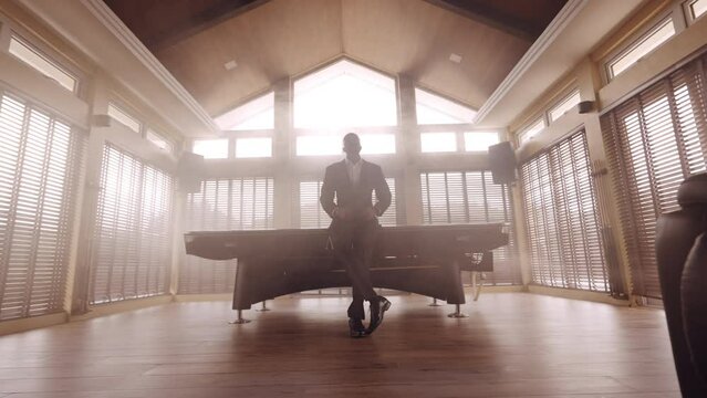 Wide Shot Of A Man Standing Inside The Pool Room