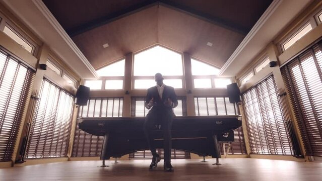 Wide Shot Of A Man Fixing His Suit