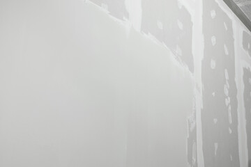 Naklejka na ściany i meble Wall covered with plaster as background, closeup