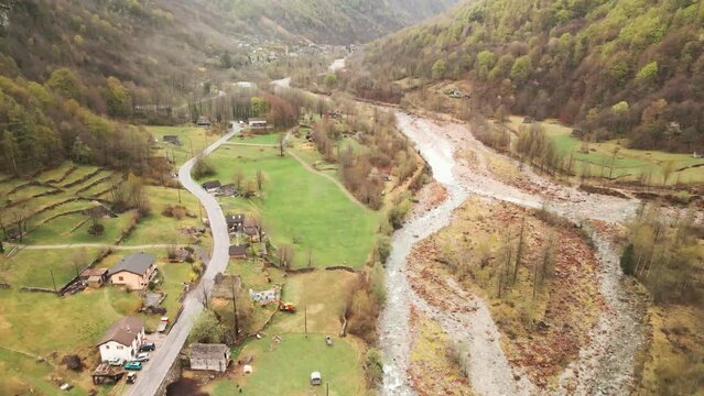 Residential Structures Of Cevio Town Near Maggia River In The Canton Of Ticino, Switzerland. Aerial Drone Shot