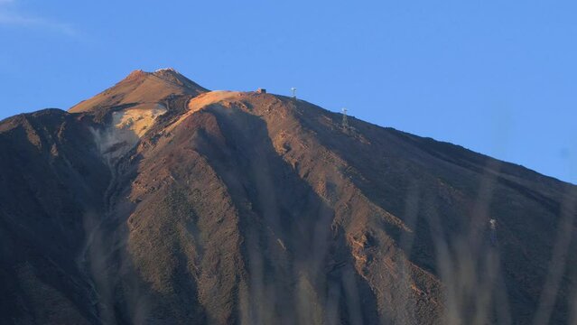 Summit of Teide volcano, scenic landscape at Teide National Park in Tenerife at Canary Islands of Spain, volcanic nature, sunny day, distant medium shot