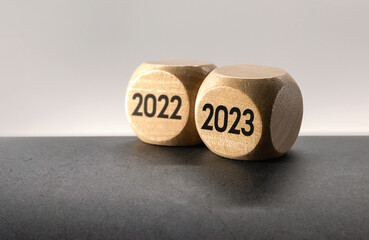 Express the process of changing to 2023 with wooden BLOCK