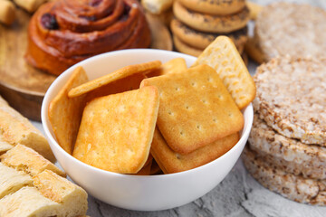 Different gluten free products on light grey textured table, closeup