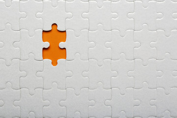 Recruitment process, searching for best applicant. Assembled jigsaw puzzle pieces with missing one,...