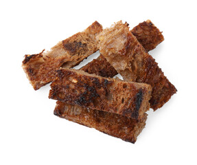 Heap of crispy rusks isolated on white, top view