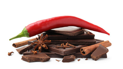 Red hot chili pepper and pieces of dark chocolate with spices isolated on white