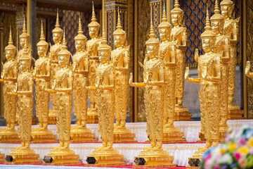 A Lot of Golden Statue standing in the temple