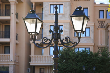 Fototapeta na wymiar Beautiful vintage street lamps near building outdoors
