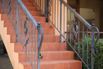 View of beautiful stairs with metal handrails near house outdoors