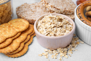 Different gluten free products on light grey table, closeup
