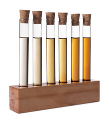 Test tubes with brown liquid in stand on white background