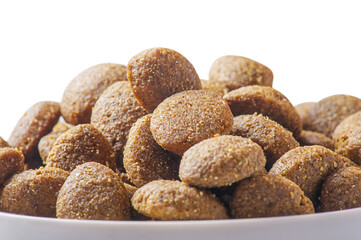 Dry pet food isolated on white background. Food for dogs or cats.