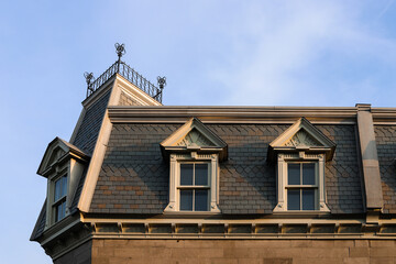 Ancient architecture of the old town. details of houses - roofs, walls, stucco decoration, beautiful windows