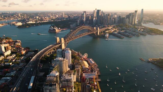 Aerial drone view of Sydney City and Sydney Harbour showing Sydney Harbour Bridge and Lavender Bay in the late afternoon       