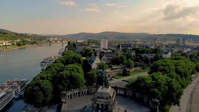 Deutsches Eck or German Corner headland in Koblenz, where the Mosel river joins the Rhine in Koblenz Germany during sunset