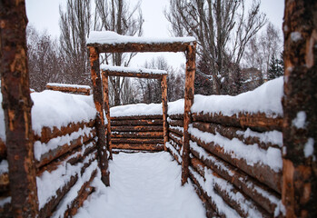 trenches made of wooden logs in winter