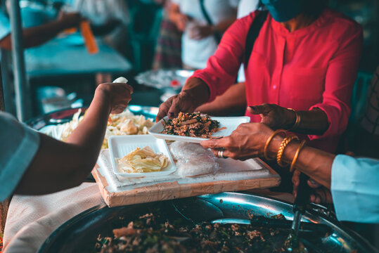 Providing free food from volunteers to the hungry poor : food donation concept, food sharing