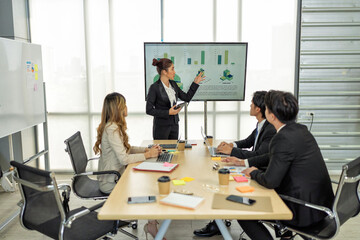 Employee meeting big screen tv presentation conference discussion brainstorming and working together