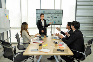 Employee meeting big screen tv presentation conference discussion brainstorming and working together