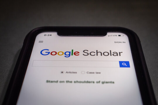 Vancouver, CANADA - Dec 9 2022 : Website of Google Scholar, a freely accessible web search engine that indexes the full text or metadata of scholarly literature, seen in an iPhone.