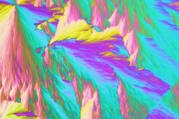 Fototapeta na wymiar Colorful micro crystals in polarized light. Photo through a microscope