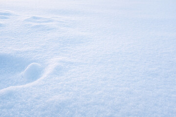 Natural snow background, top view. Snow texture for publication, poster, screensaver, wallpaper, postcard, banner, cover, post. Winter backdrop. High quality photo