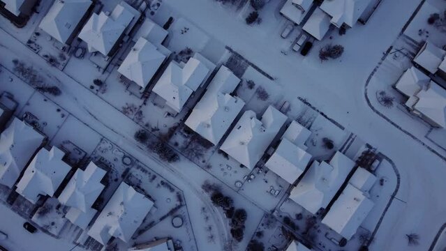 Spinning clockwise shot of the winter community taken from drone