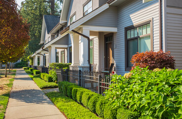 Houses in suburb at summer in north America. Houses with nice landscape. Houses in beautiful residential neighbourhood