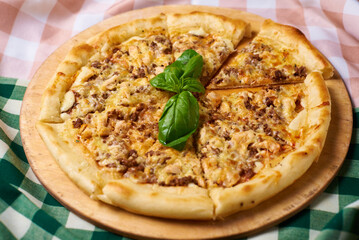 italian pizza with minced meat and mushrooms
