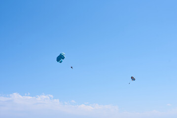 two paratroopers against the blue sky